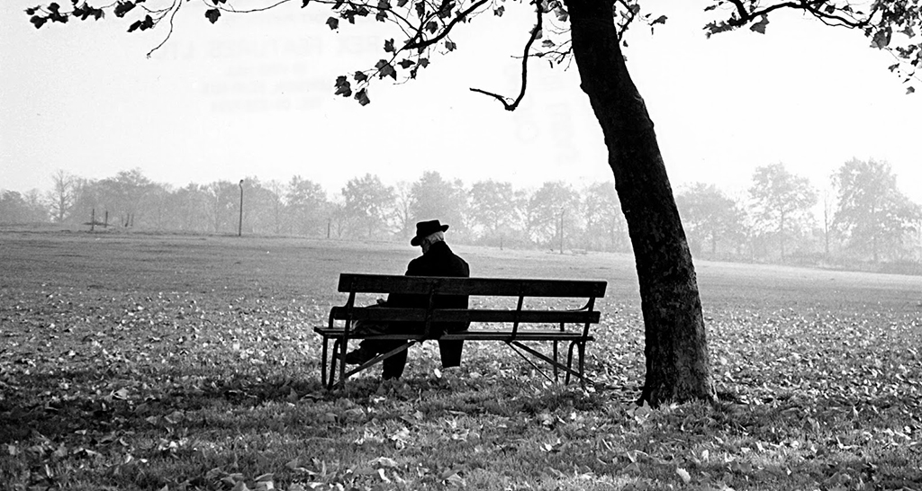 Man-sitting-on-a-bench-un-014 Ιερός Ναός Αγίου Γεωργίου Κορυδαλλού